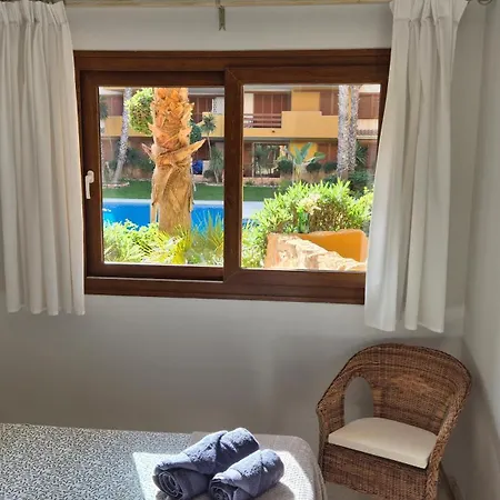 Appartement Ground Floor Punta Prima Looking At The Pool
